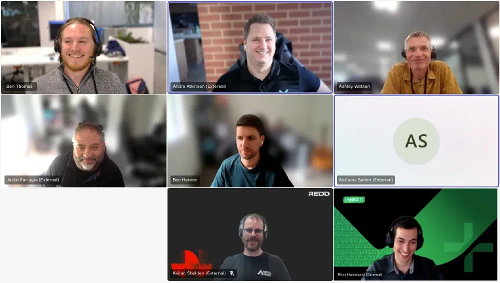 Nine people in a grid-style video call.  Participants include Ben Thomas, Andre Atkinson, Ashley Watson, Justin Farrugia, Ben Harmer, Anthony Spiteri, Keiran Shelden, and Rhys Hammond. Veeam and Redd logos are visible.  This is a call of the ANZ Veeam 100 & Friends community.